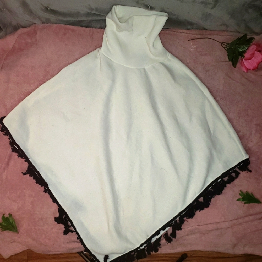 WHITE TURTLENECK PONCHO SWEATER WITH BLACK TASSELS SIZE L